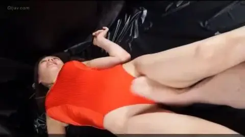 Brunette in Swimsuits on Leather Surface