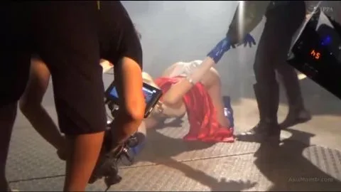 Blonde Asian Woman in Red Skirt Performs Erotic Acts