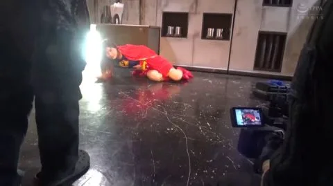 Woman dominated on ground and black cloth