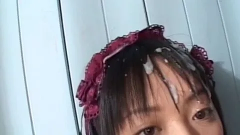 Asian Teen Cries and Smiles Indoors