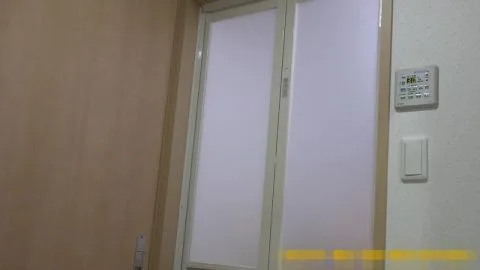 Asian Woman Topless in Bathroom