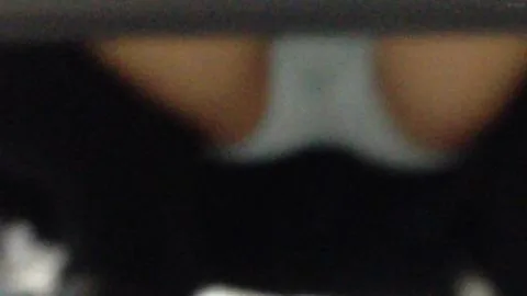 Blonde Woman and Man Embracing in Store