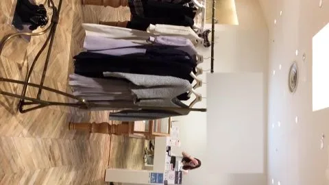 Asian Girls Try On Outfits in Clothing Store