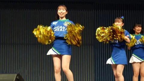 Asian Girls Dancing with Pompoms on Stage