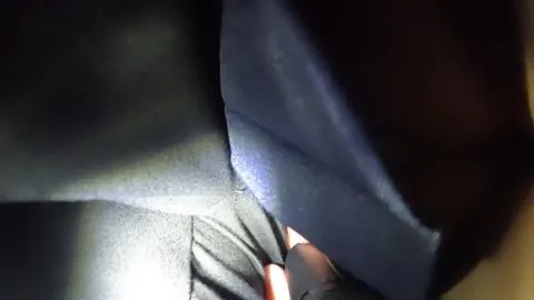 Man Adjusts Clothing in Dark POV