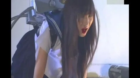 Asian woman in metallic headpiece and mechanical device