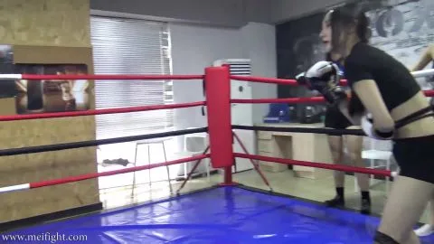 Asian Women Wrestling in Boxing Ring