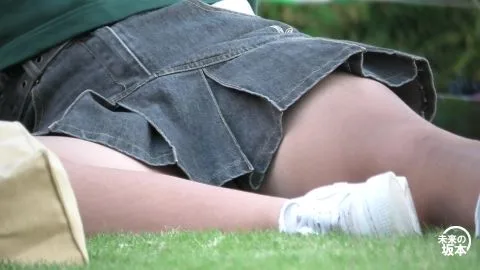 Asian Girls Relaxing in Denim Skirts Outdoors
