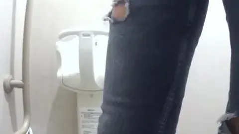 Asian Girl Urinating in Bathroom