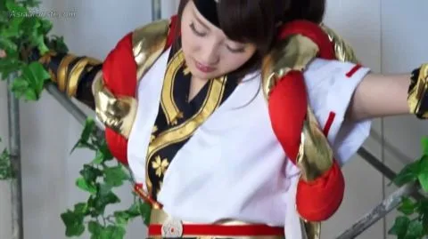 Asian Girl in Red Costume with Sword