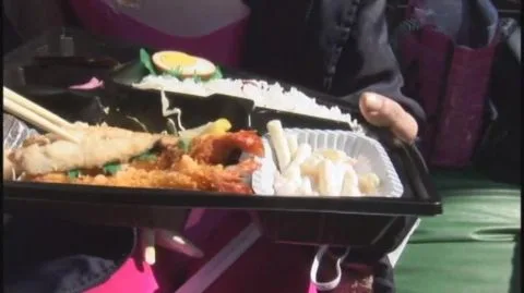 Asian Women in Pink Costumes with Muscular Man