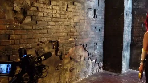 Redhead in Red Costume Fights in Abandoned Building