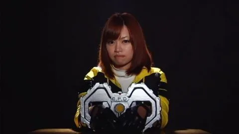 Red-Haired Asian Woman in Futuristic Jacket