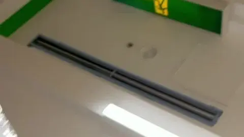 Asian Woman in Store Aisle