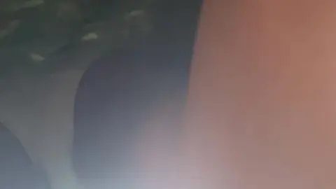 Slim Brunette with Lower Back Tattoo in Bedroom