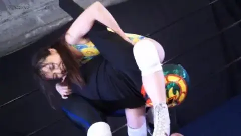 Asian girl in yellow leotard wrestles with man