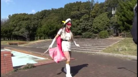 Asian Cosplay Duo in Costumes Pose and Embrace