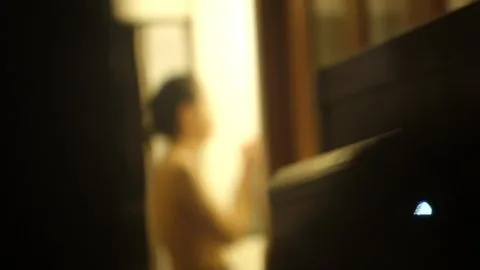 Asian Teen by the Window