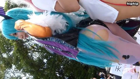 Asian Cosplayer in Pink Bodysuit and Bat Wings