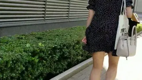 Brunette in Black Dress Walking Outdoor
