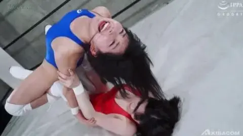 Wrestling Match Between Two Brunette Women