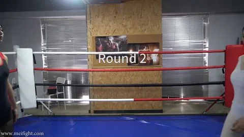 Asian Women Wrestling in Boxing Ring