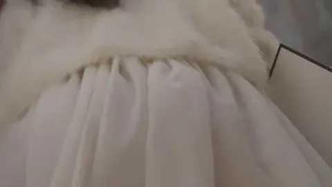 Asian Woman Adjusting Dress