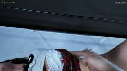 Asian Teen with Boxing Gloves on Bed