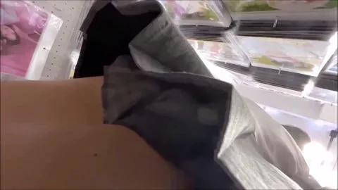 Asian Tattooed Girl in Store Setting