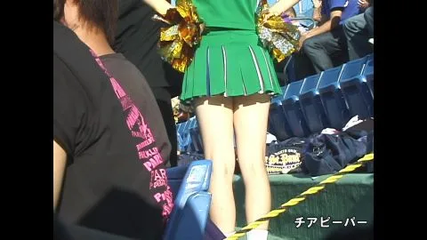 Asian Cheerleader in Green Uniform