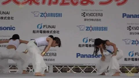 Asian Girls Dance in White Outfits on Stage