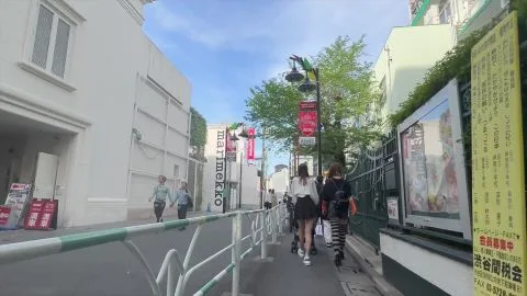 Asian Women in Striped Tights on City Street