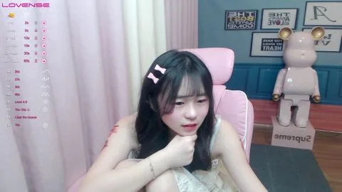 Asian Teen with Pink Bows in Hair