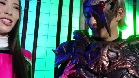 Asian Couple in Elaborate Costumes Pose in Neon Studio