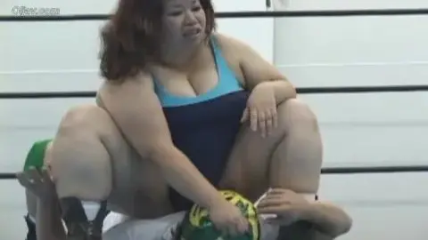 Curvy Women Engage in Intense Wrestling Match