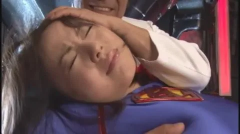 Asian Couple in Superman Costume Intimate Moments