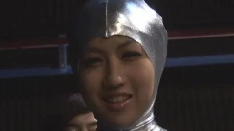 Asian Performer in Silver Costume