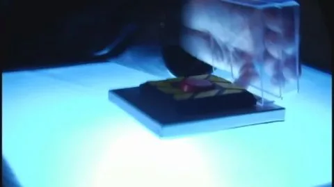 Asian Cosplay Tease in Dimly Lit Stage