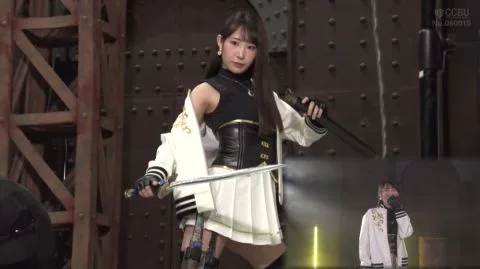 Asian Teen Performs on Stage with Sword