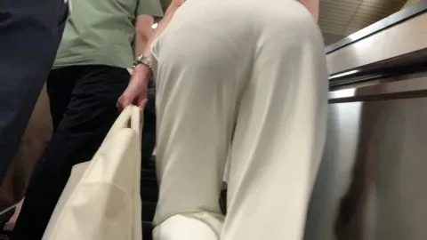 Woman in White Pants in Public Places