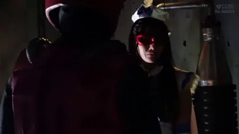 Asian Couple in Costumes Embracing in Industrial Setting