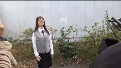 Asian woman in costume partially unclothed and restrained