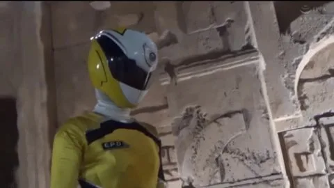 Men in Yellow and White Suits Engage in Playful Kicking