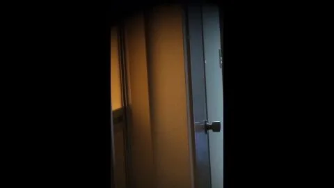 Man Getting Dressed in Bedroom