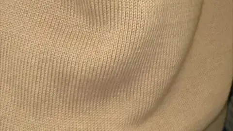 Asian teen in plaid skirt and uniform