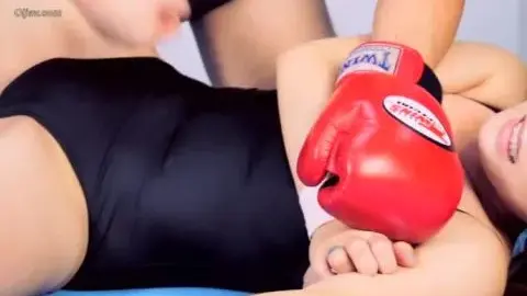 Dark-haired woman in bodysuit restrained and dominated