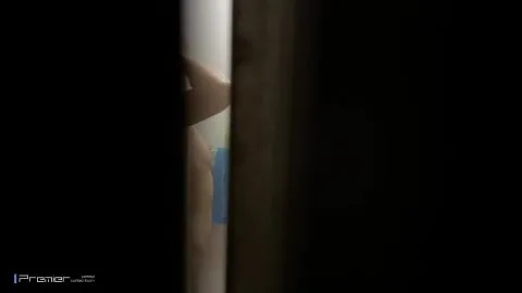 Caucasian Brunette Showering in Bathroom