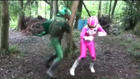 Asian Women in Costume Fighting in Forest