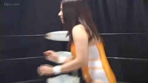 Wrestling Match Between Women in Colorful Singlets