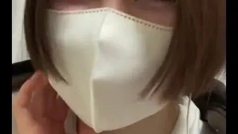 Asian Girl with Face Mask Plays with Vibrator